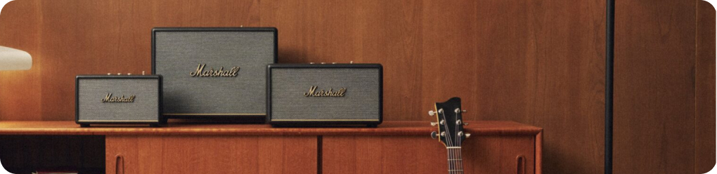 3 marshall speakers and guitar